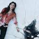 Megan Fox's Emma lays on broken ice, covered in blood, and handcuffed to her dead husband who has already fallen through the ice in the horror film Till Death.
